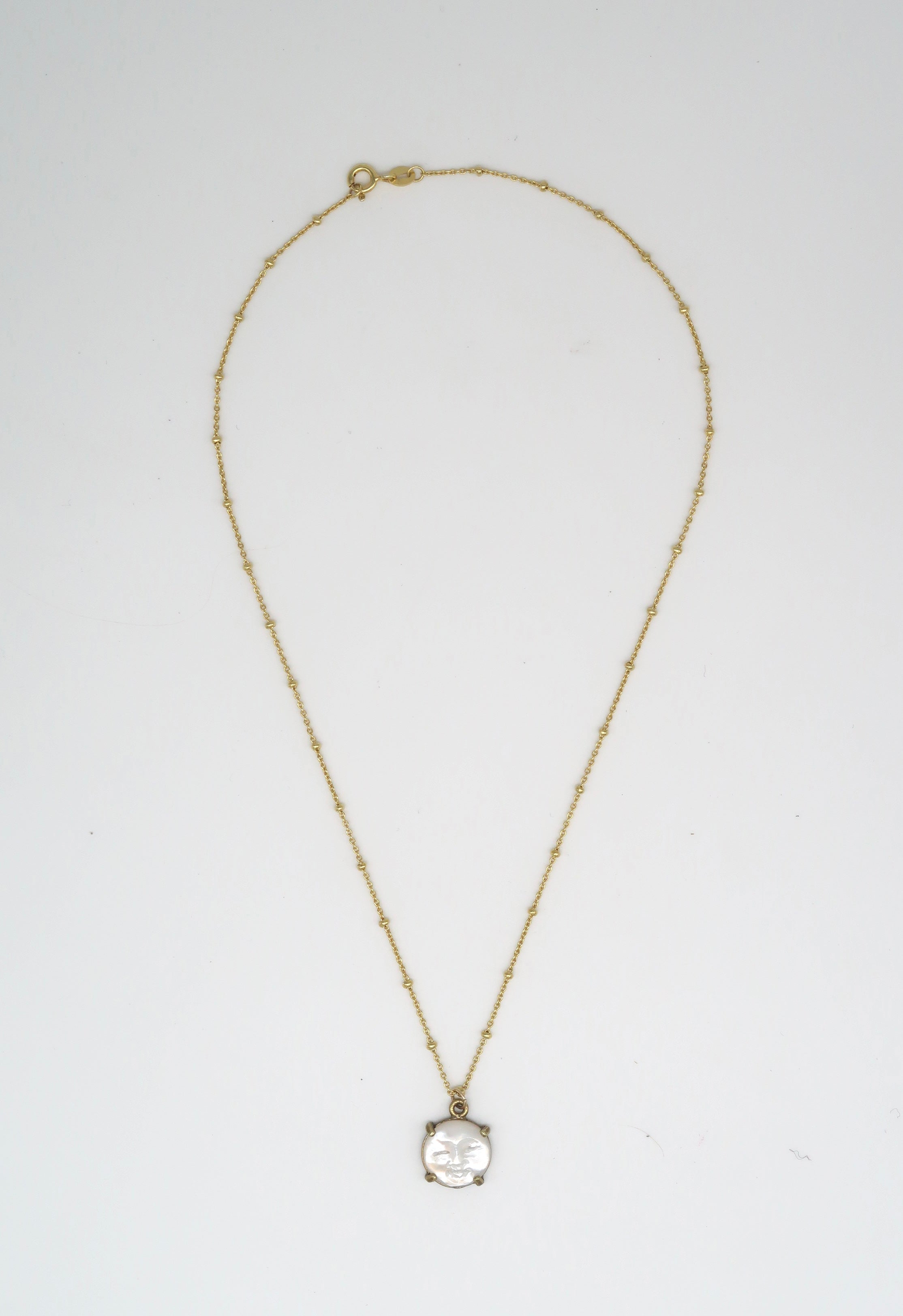 Tiny Hand-Carved Mother of Pearl Moon Face Necklace